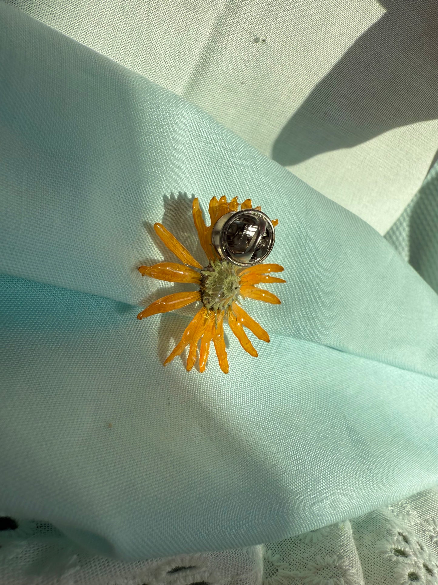 Orange wildflower pin