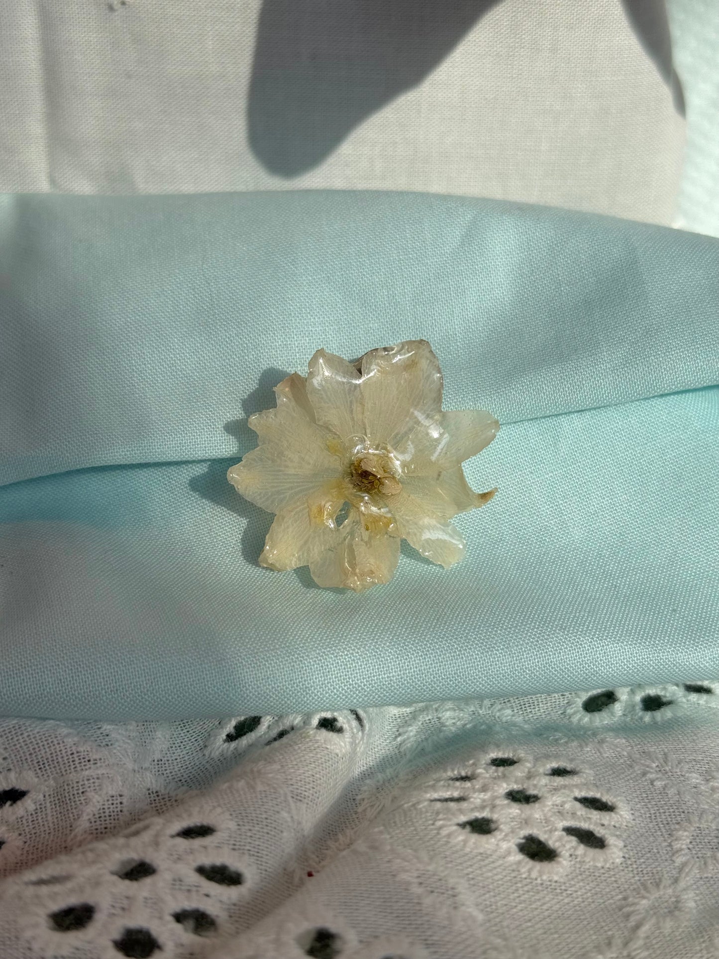 White flower pin